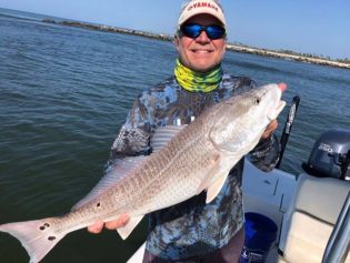 Angler Holding Huge Red