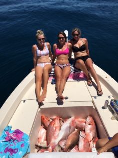 Happy Anglers with Boat Full of Fish