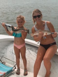 Mother and Daughter holding fish