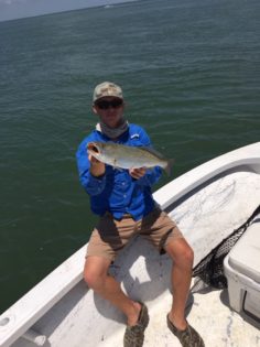 Young Adult holding a fish