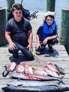 Young boys with the fish caught on the charter