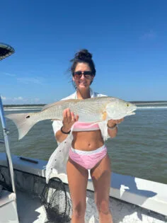 Girl with Redfish Catch